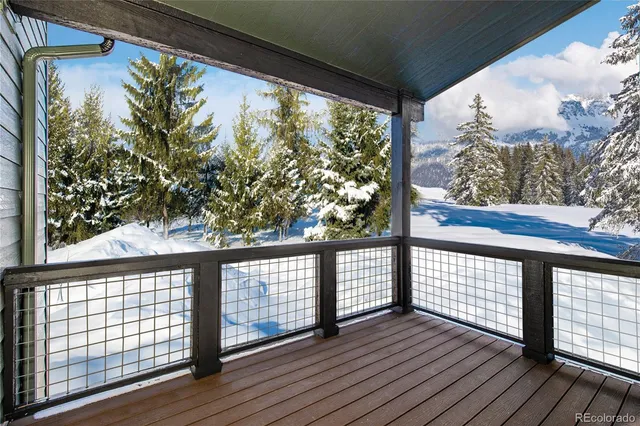 a view of a balcony with wooden floor