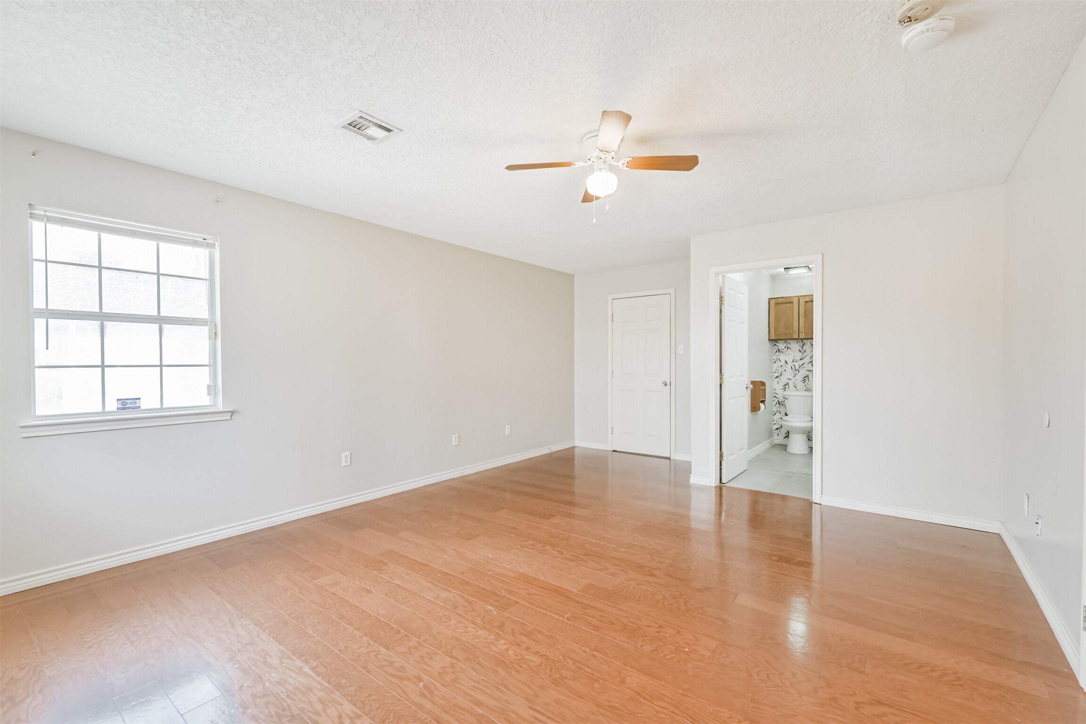 1103 Williams Street Cleveland, TX 77327 - Photo 20 of 32 a view of an empty room with a window