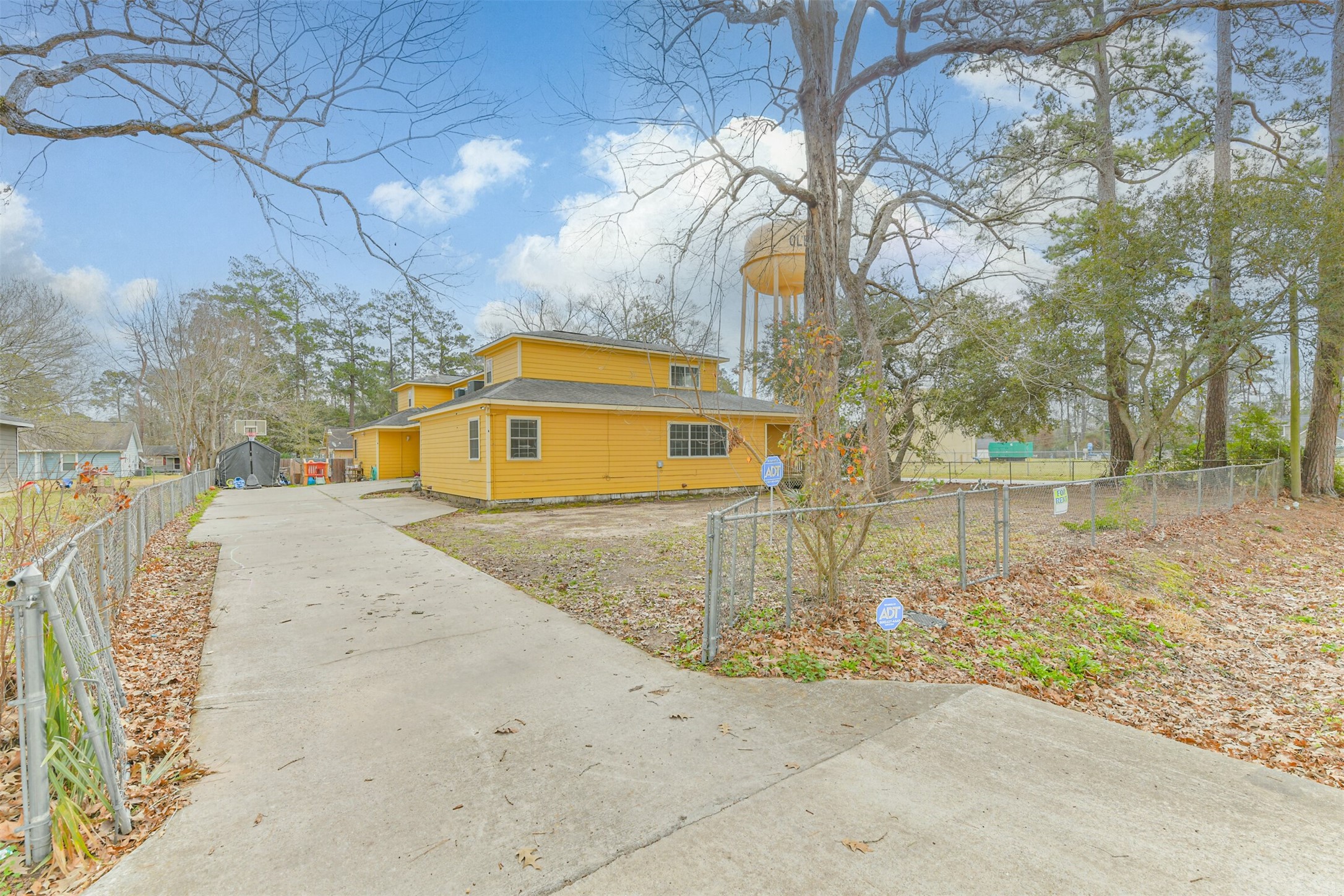 1103 Williams Street Cleveland, TX 77327 - Photo 2 of 32 a front view of a house with a yard