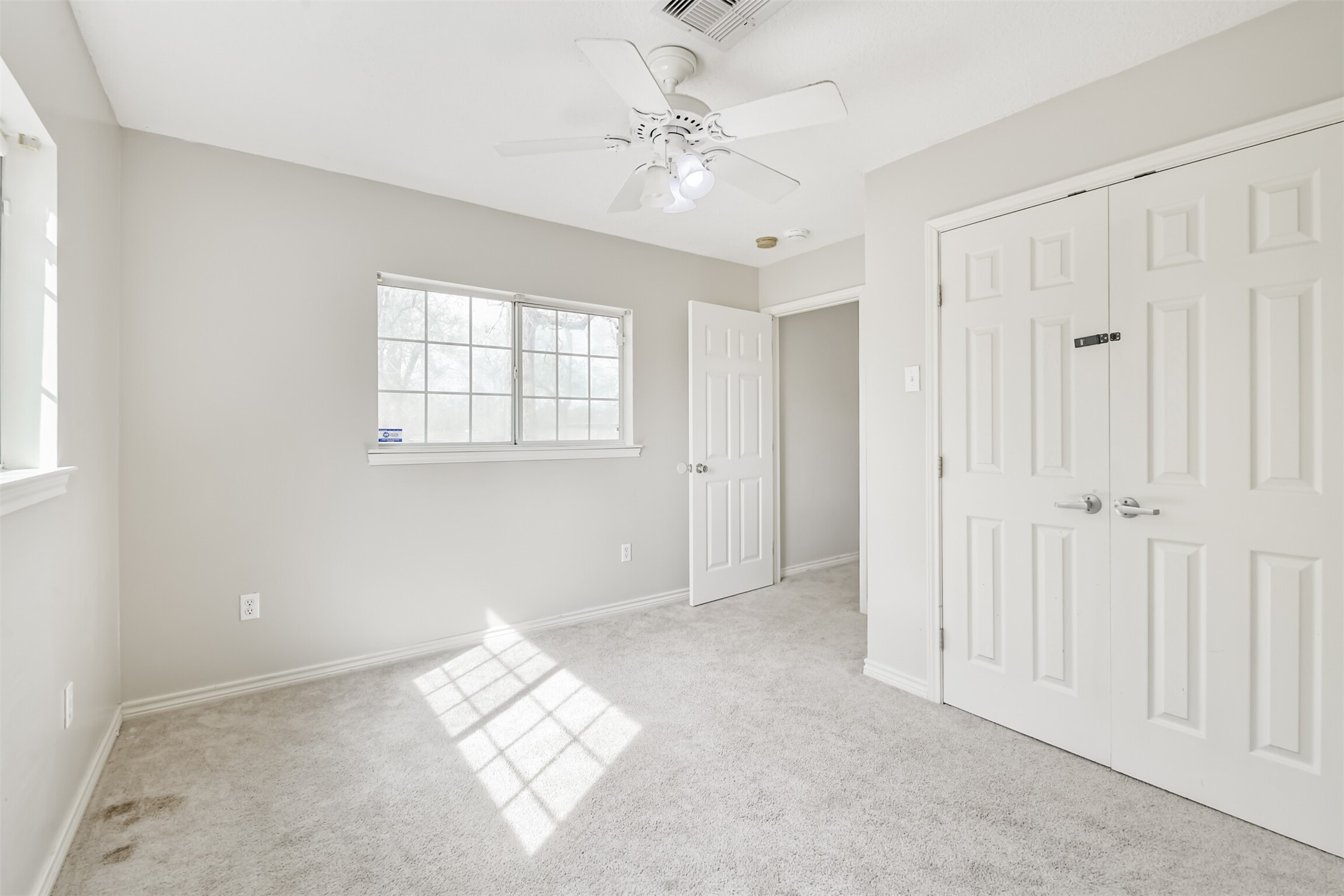 1103 Williams Street Cleveland, TX 77327 - Photo 26 of 32 a view of an empty room with a window