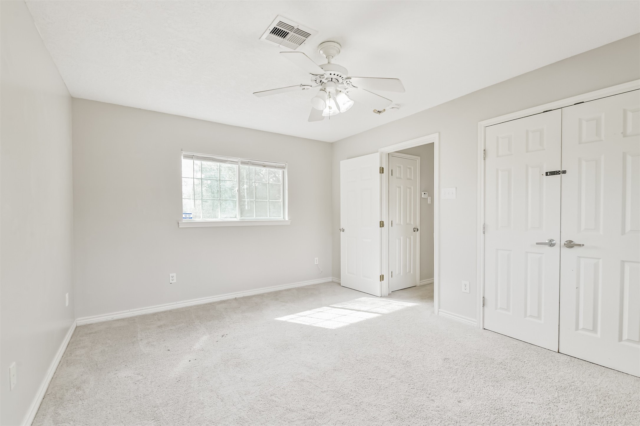 1103 Williams Street Cleveland, TX 77327 - Photo 29 of 32 a view of an empty room with a window
