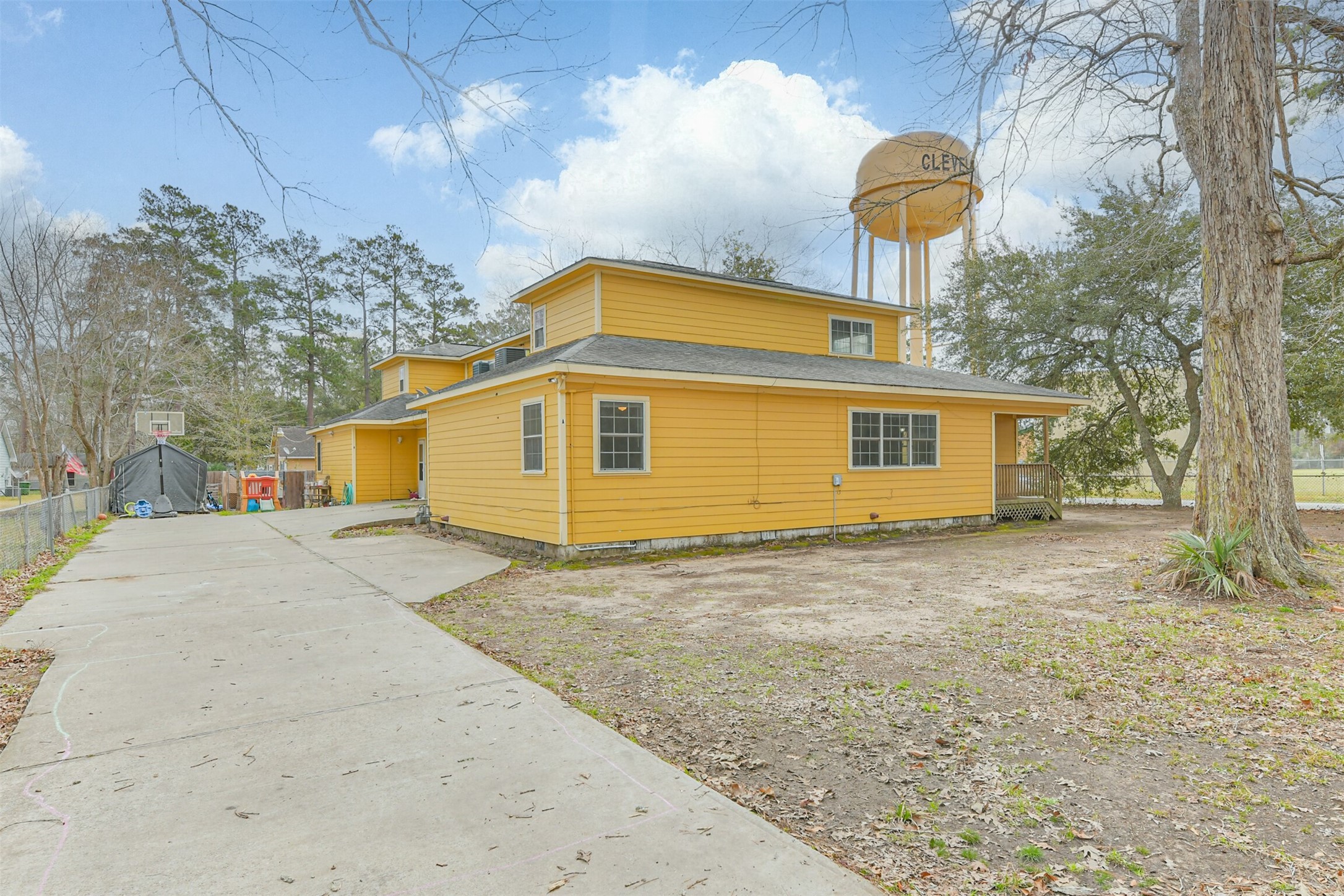 1103 Williams Street Cleveland, TX 77327 - Photo 3 of 32 a front view of a house with a yard and garage