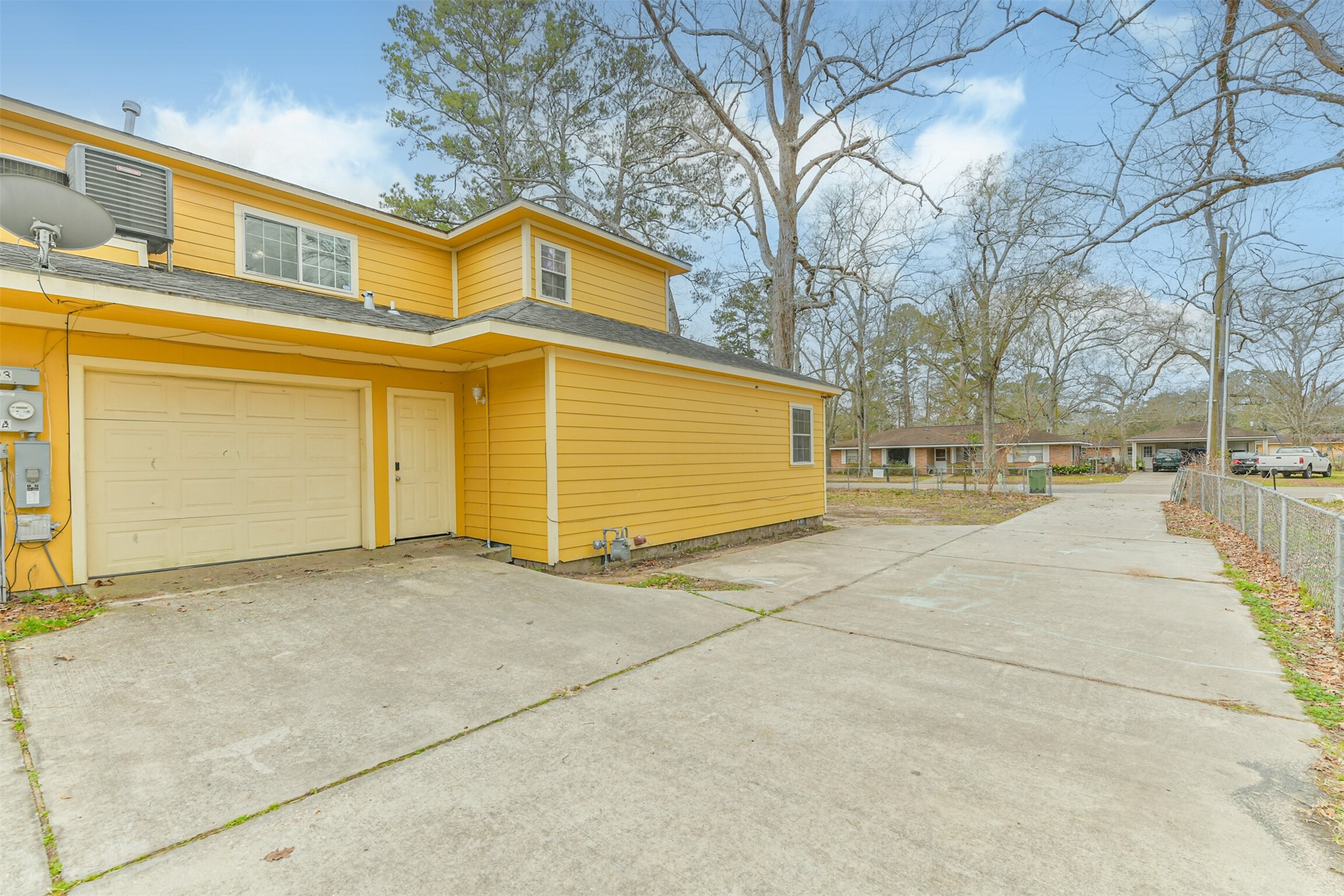 1103 Williams Street Cleveland, TX 77327 - Photo 4 of 32 a view of a house with a garage
