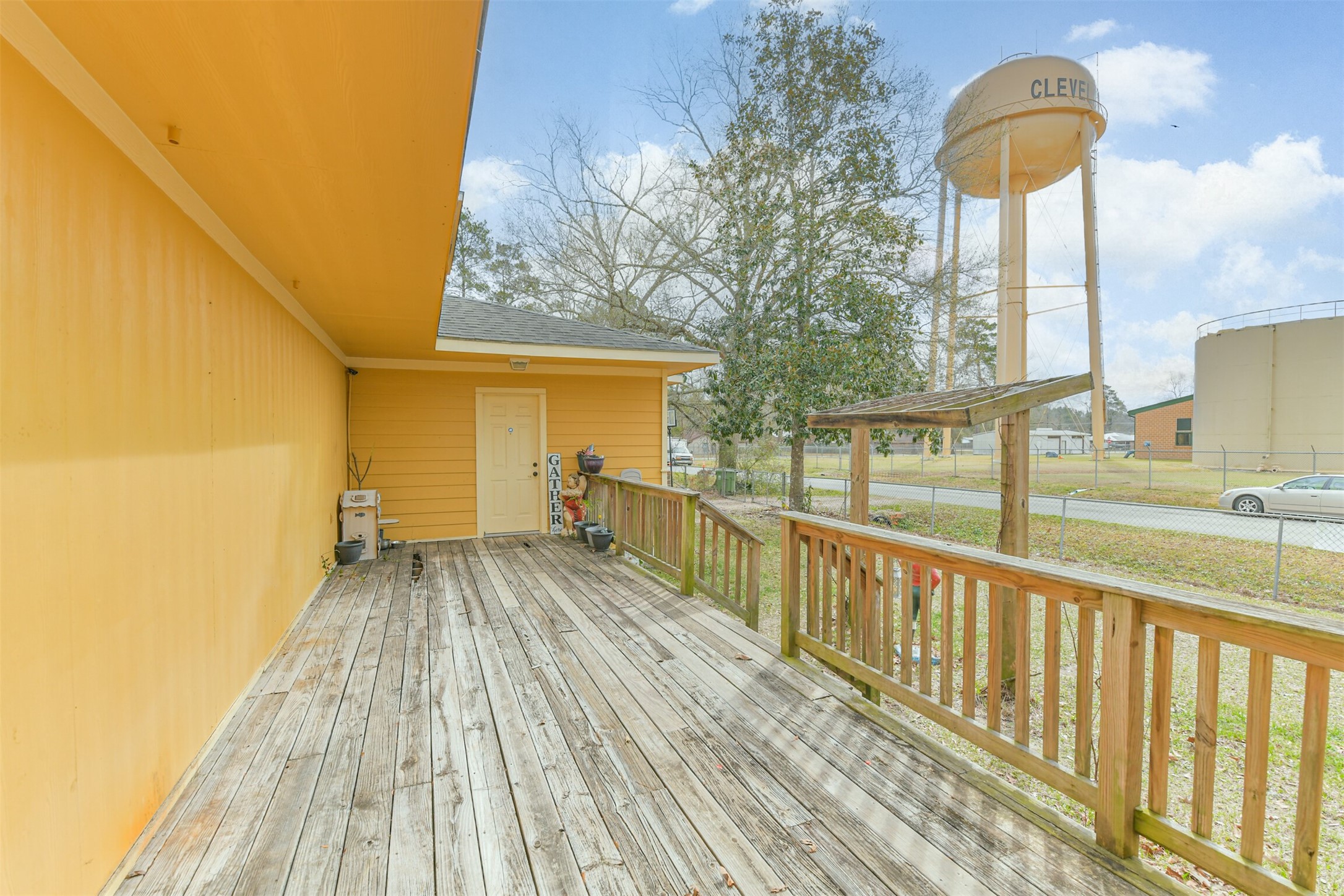 1103 Williams Street Cleveland, TX 77327 - Photo 7 of 32 a view of a balcony with trees