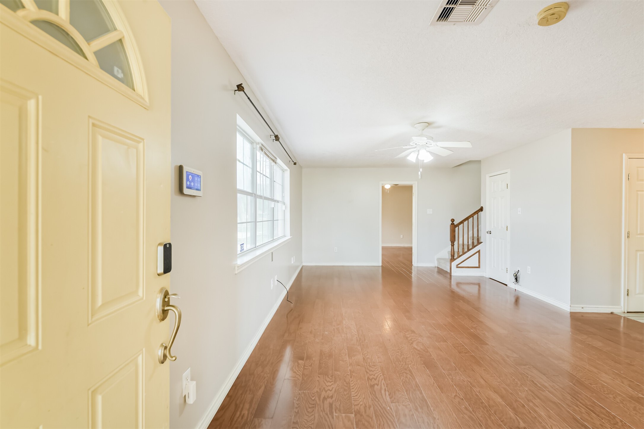 1103 Williams Street Cleveland, TX 77327 - Photo 9 of 32 a view of an entryway with wooden floor
