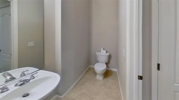 an empty room with closet and a window