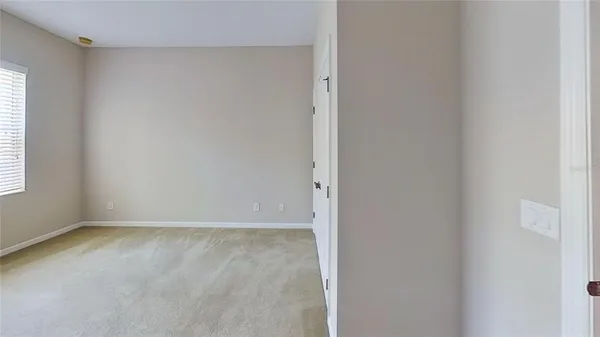 a kitchen with granite countertop cabinets and refrigerator