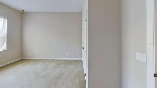 a kitchen with granite countertop cabinets and refrigerator