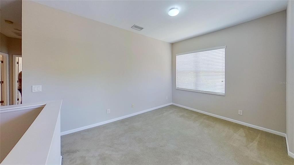 10620 Whittington Court Largo, FL 33771 - Photo 21 of 68 an empty room with a window