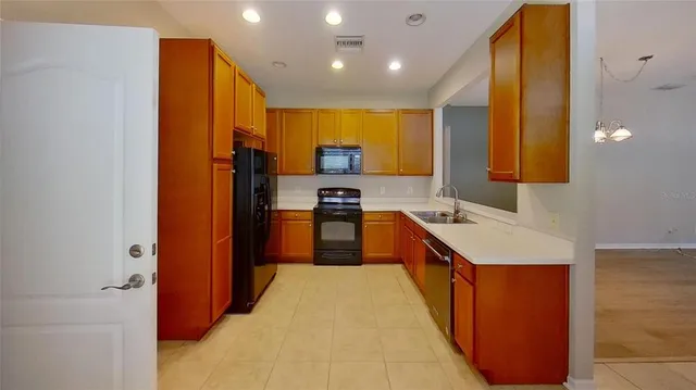 a view of a room with wooden floor and a window