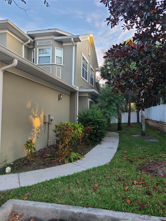 10620 Whittington Court Largo, FL 33771 - Photo 3 of 68 a front view of a house with garden