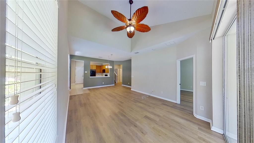 10620 Whittington Court Largo, FL 33771 - Photo 32 of 68 a view of an empty room with window and wooden floor