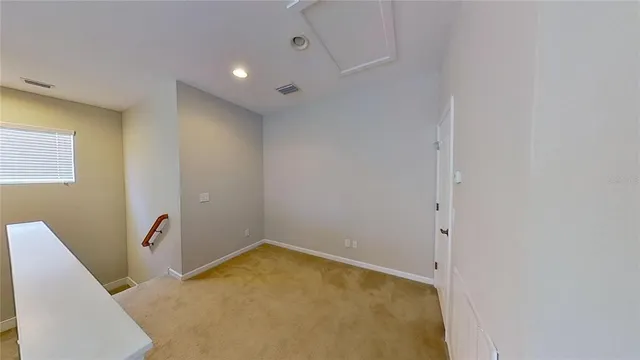 an aerial view of residential houses with city view