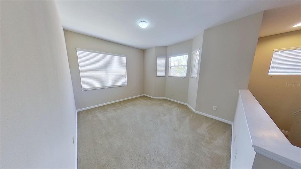 10620 Whittington Court Largo, FL 33771 - Photo 48 of 68 an empty room with windows