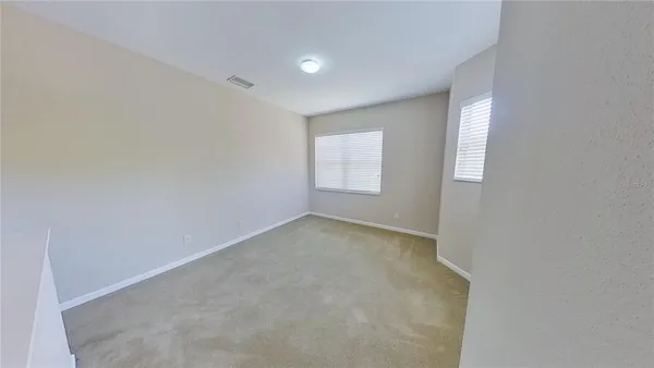 a view of living room with furniture and wooden floor
