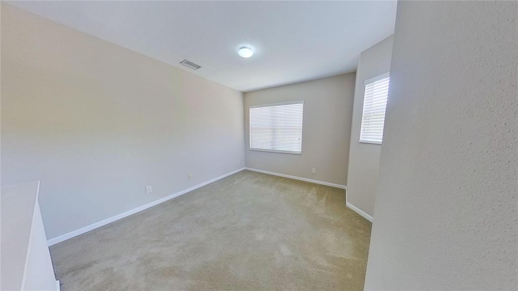 10620 Whittington Court Largo, FL 33771 - Photo 50 of 68 an empty room with windows