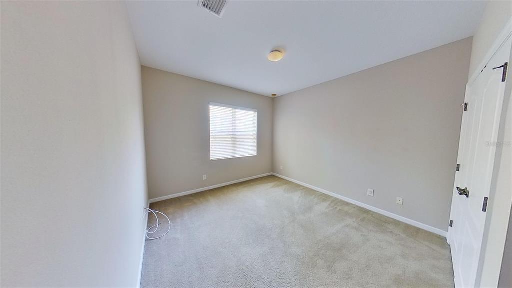10620 Whittington Court Largo, FL 33771 - Photo 51 of 68 a view of an empty room with a window