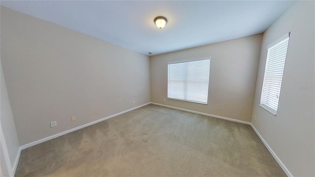 10620 Whittington Court Largo, FL 33771 - Photo 52 of 68 an empty room with windows