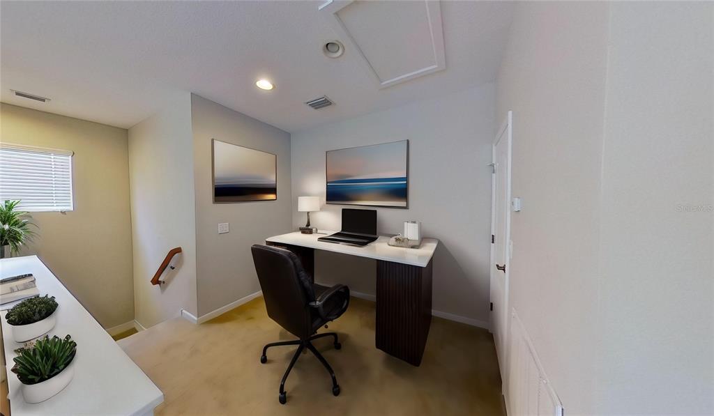 10620 Whittington Court Largo, FL 33771 - Photo 7 of 68 a view of workspace filled with furniture and wooden floor