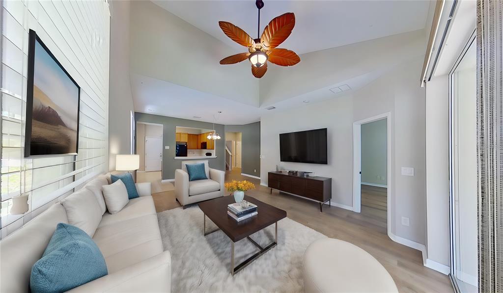 10620 Whittington Court Largo, FL 33771 - Photo 9 of 68 a living room with furniture and a flat screen tv