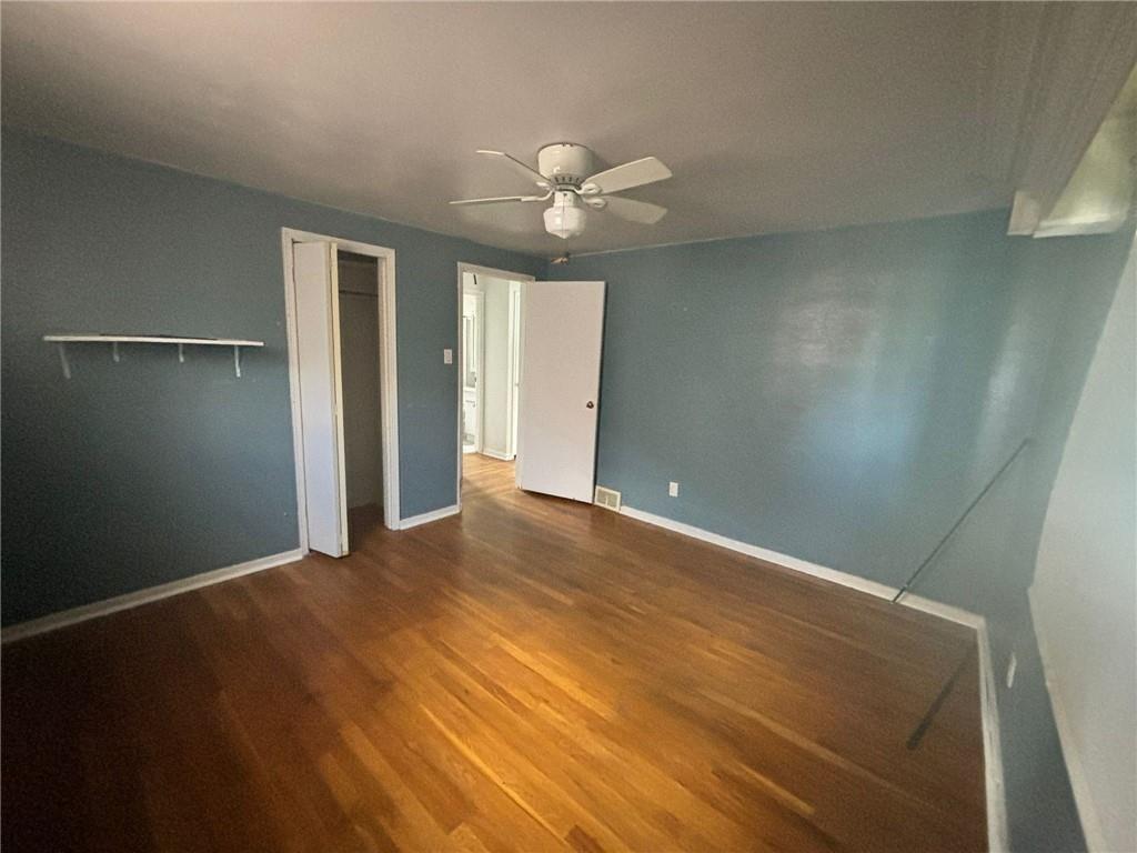 270 Wheeler Avenue McKees Rocks, PA 15136 - Photo 11 of 28 an empty room with closet and a chandelier fan