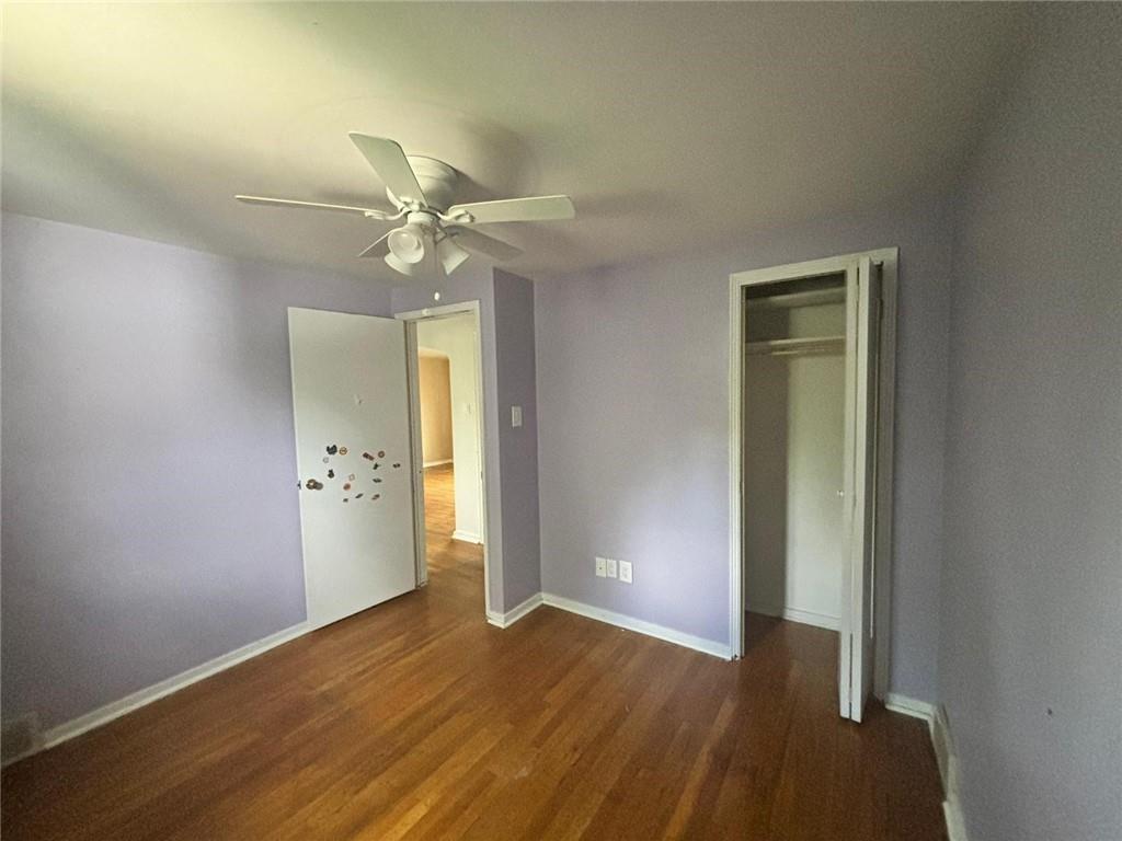 270 Wheeler Avenue McKees Rocks, PA 15136 - Photo 13 of 28 an empty room with closet and a chandelier fan