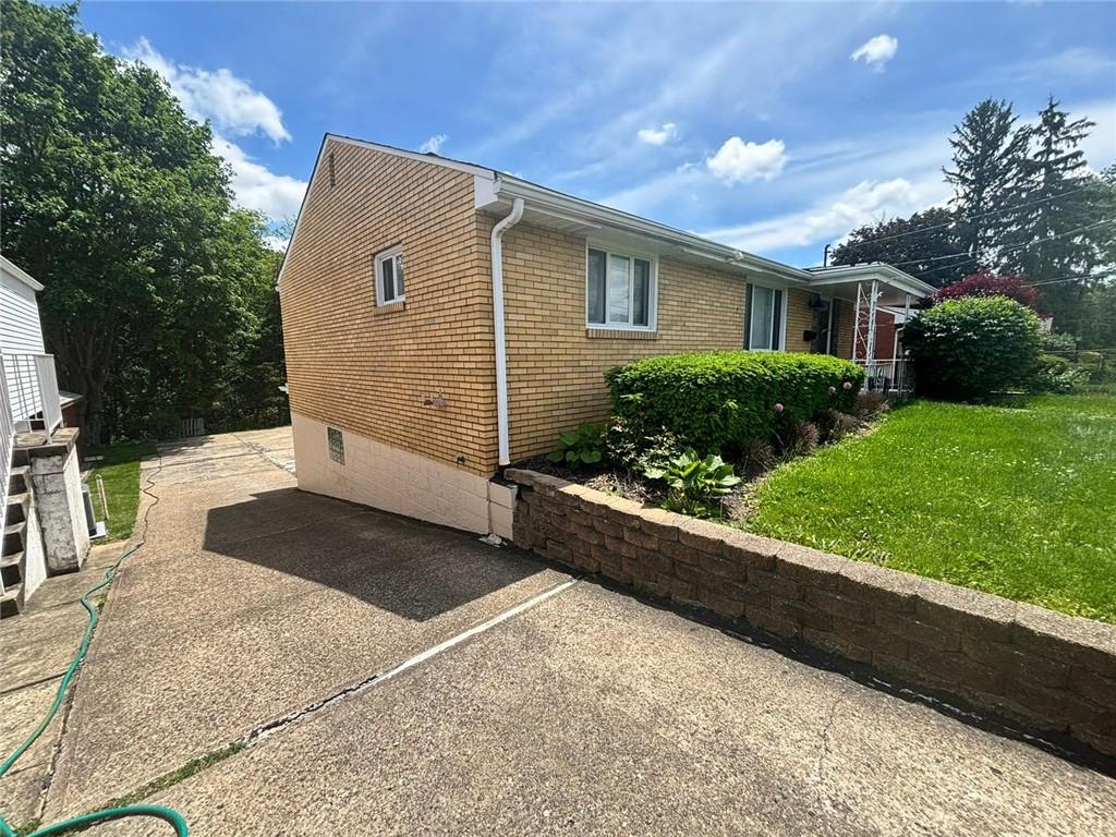 270 Wheeler Avenue McKees Rocks, PA 15136 - Photo 24 of 28 a view of a house with a yard and a large tree