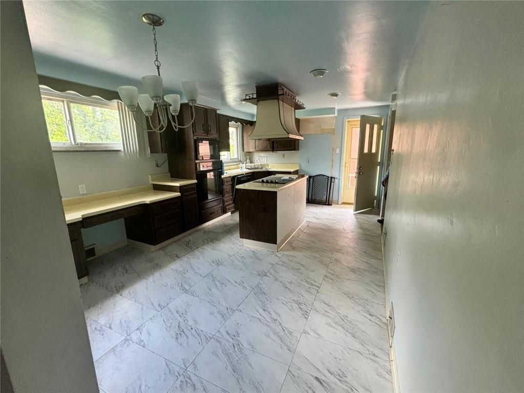 270 Wheeler Avenue McKees Rocks, PA 15136 - Photo 3 of 28 a kitchen with stainless steel appliances granite countertop a sink stove and refrigerator