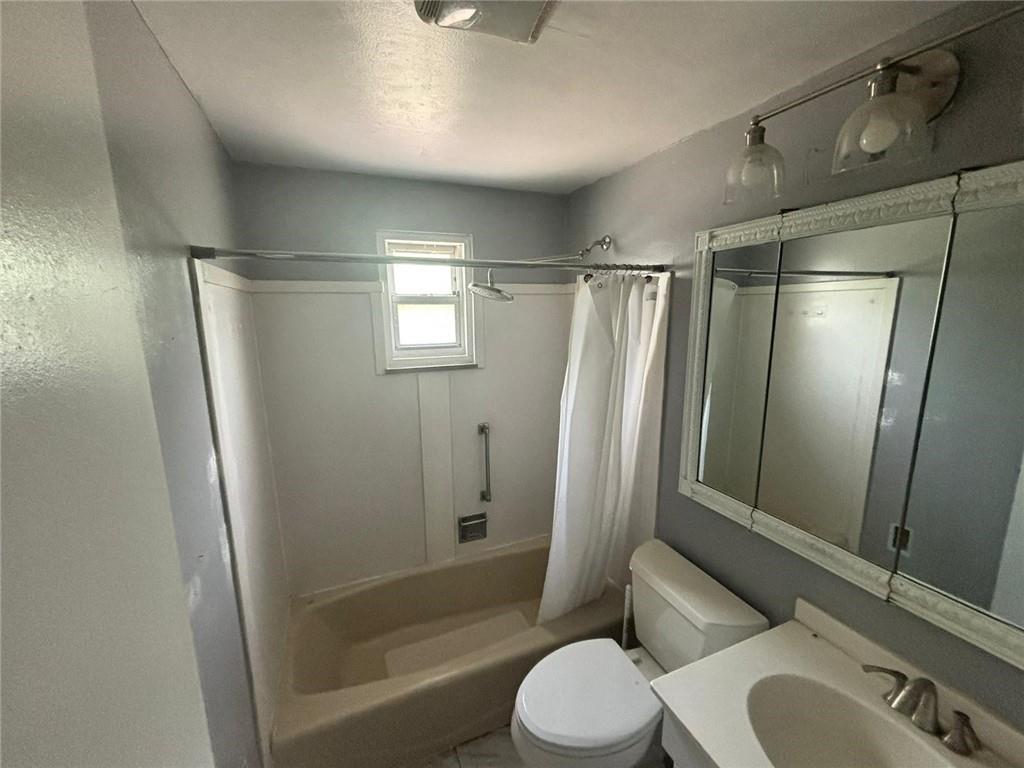 270 Wheeler Avenue McKees Rocks, PA 15136 - Photo 6 of 28 a bathroom with a shower toilet and sink