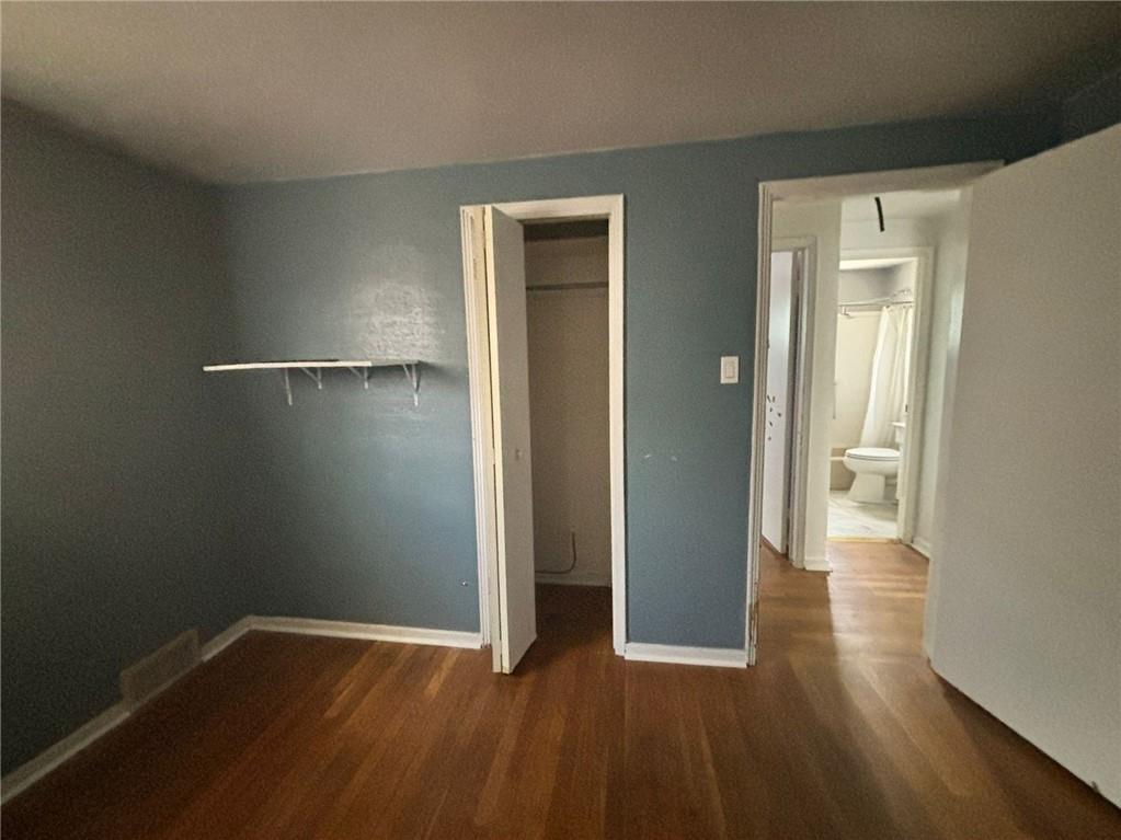 270 Wheeler Avenue McKees Rocks, PA 15136 - Photo 10 of 28 an empty room with wooden floor and closet