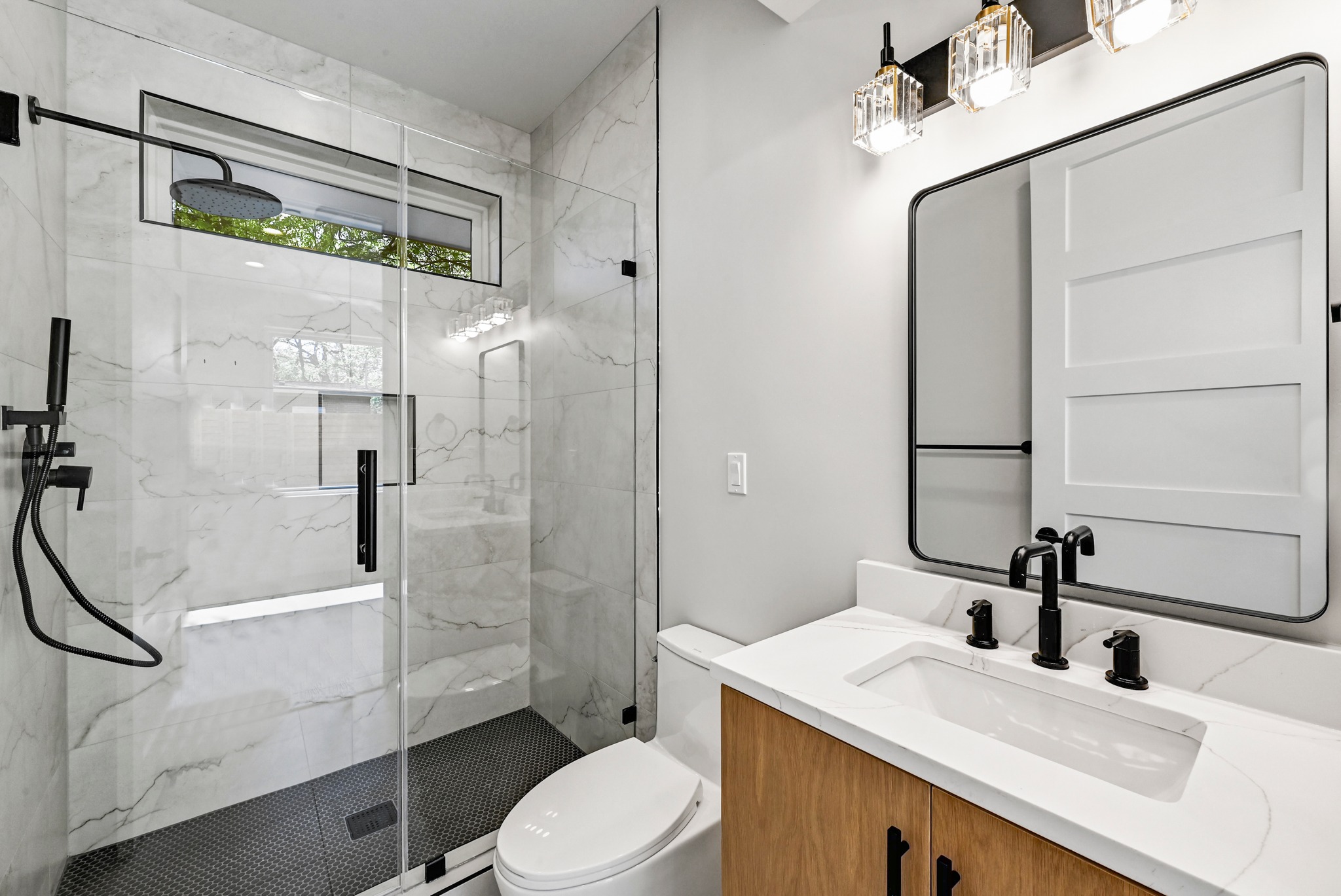 100 West Odell Street, Unit 2 Austin, TX 78752 - Photo 8 of 36 1st Floor Bathroom featuring a spacious walk in shower.