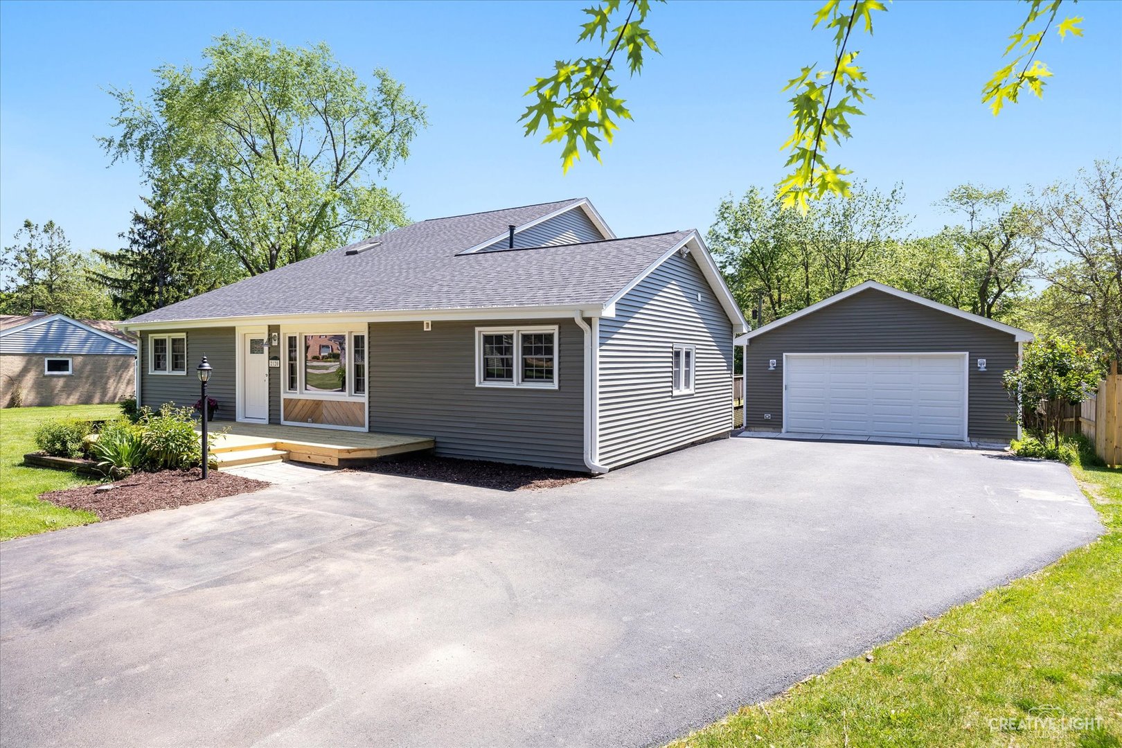 2120 Rockwell Road Aurora, IL 60506 - Photo 3 of 40 a front view of a house with a yard and potted plants