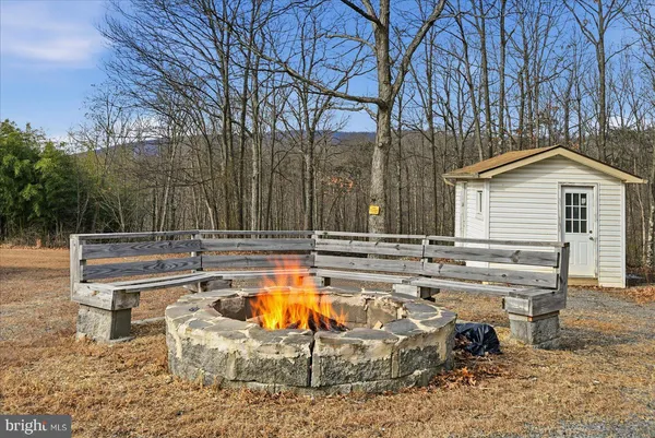 a view of a house with swimming pool and sitting area