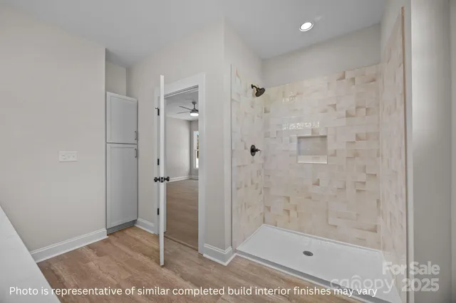 a bathroom with a shower and a sink