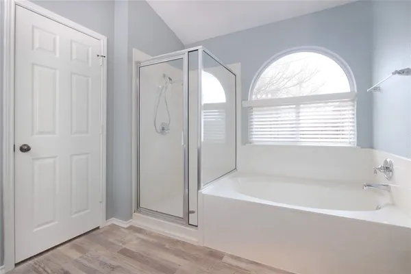 a white bath tub sitting next to a window