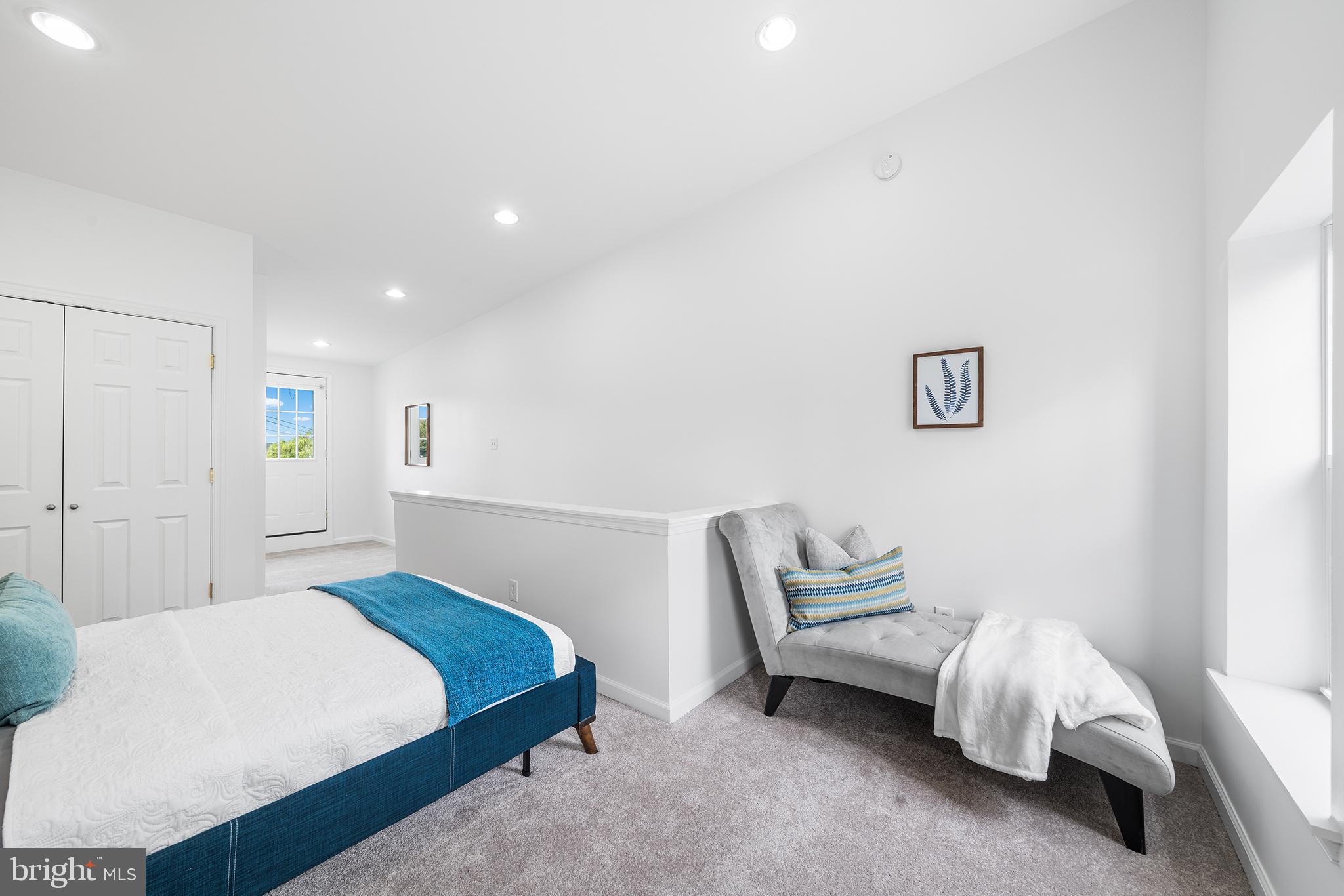 5202 Ridge Avenue Philadelphia, PA 19128 - Photo 21 of 30 a bedroom with a bed and a couch