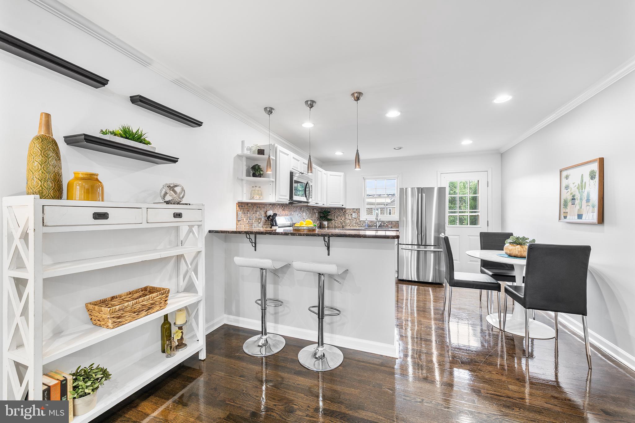 5202 Ridge Avenue Philadelphia, PA 19128 - Photo 3 of 30 a living room with furniture and a wooden floor
