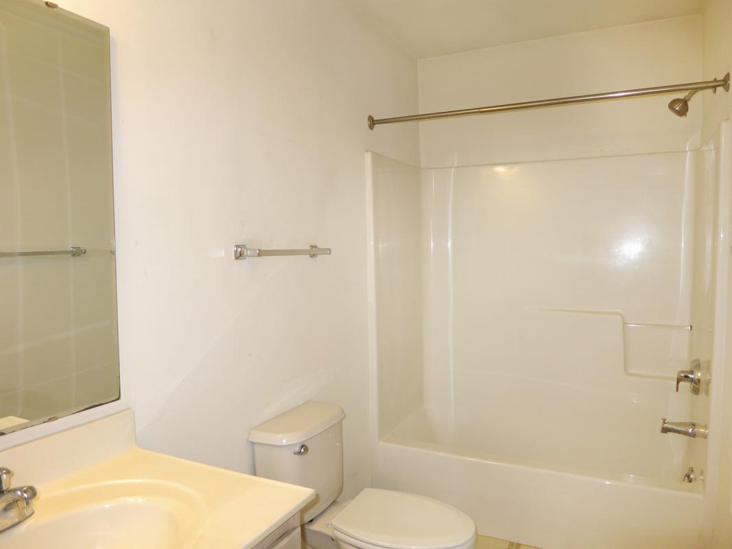 320 Davie Road Carrboro, NC 27510 - Photo 13 of 20 a white toilet sitting next to a bath tub