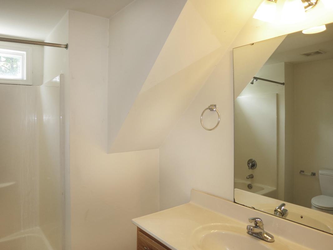 320 Davie Road Carrboro, NC 27510 - Photo 16 of 20 a bathroom with a sink and a mirror