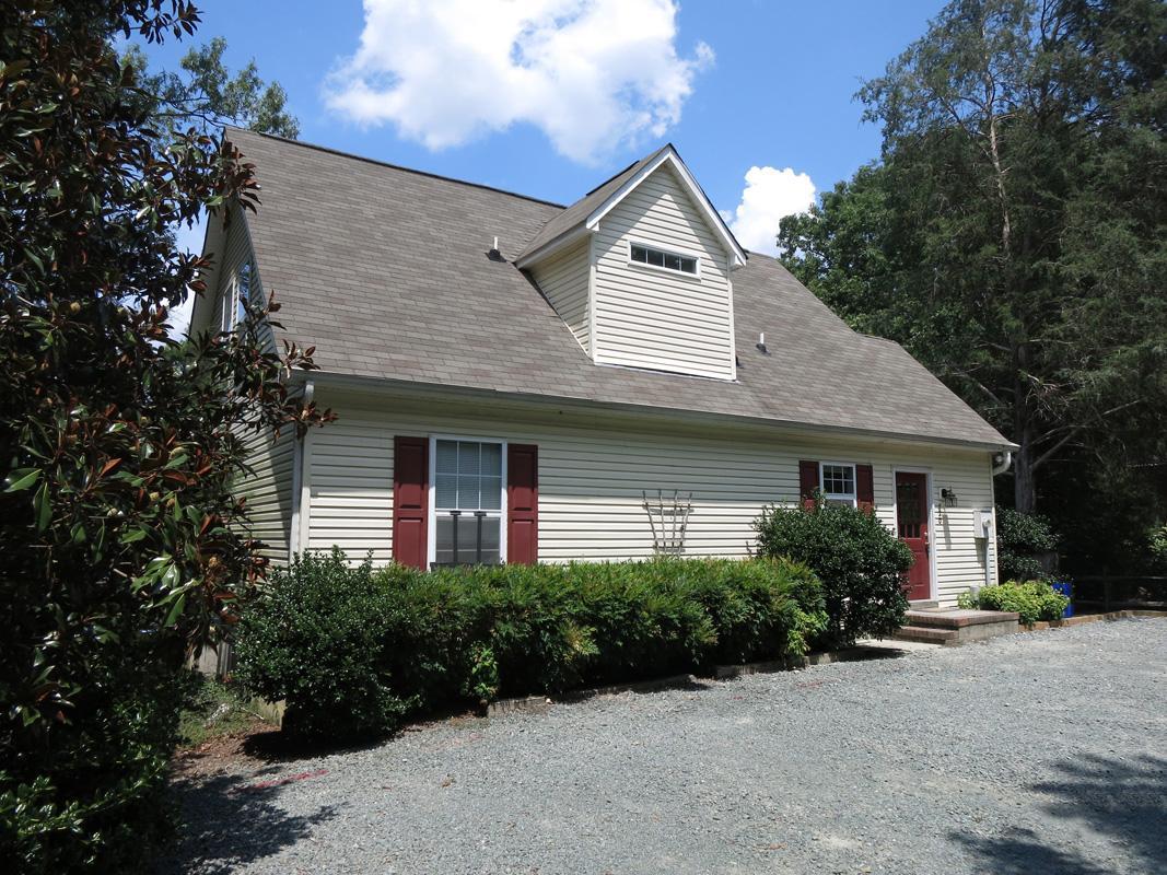 320 Davie Road Carrboro, NC 27510 - Photo 2 of 20 a front view of a house with a garden