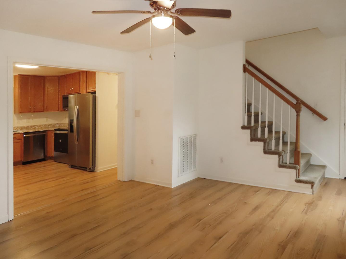 320 Davie Road Carrboro, NC 27510 - Photo 4 of 20 a view of an empty room with a window and wooden floor