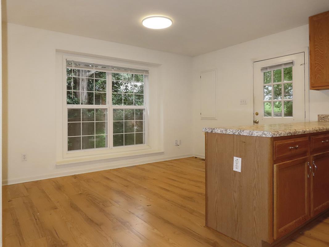 320 Davie Road Carrboro, NC 27510 - Photo 5 of 20 a view of a kitchen with a sink and a window