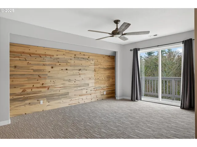 a bathroom with a tub a sink and a large mirror