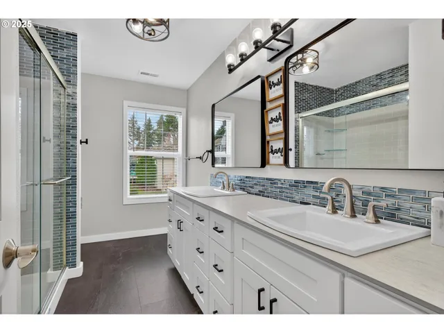 a utility room with sink dryer and washer