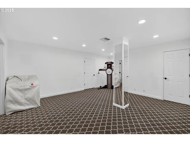 a kitchen with a refrigerator and a stove