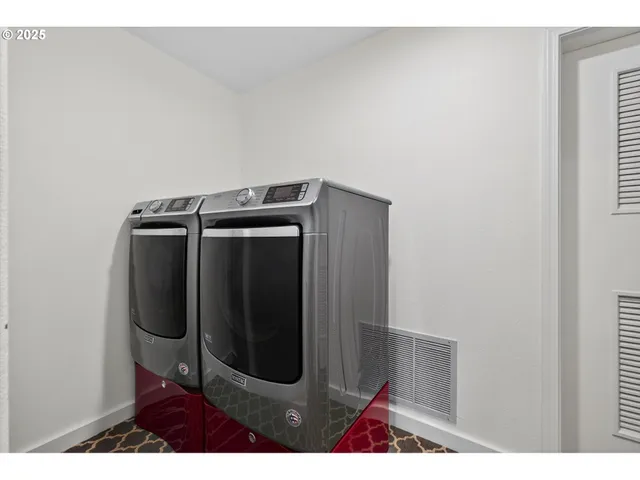 a room with pool table and windows