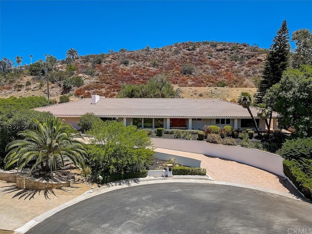 an aerial view of multiple house with a yard