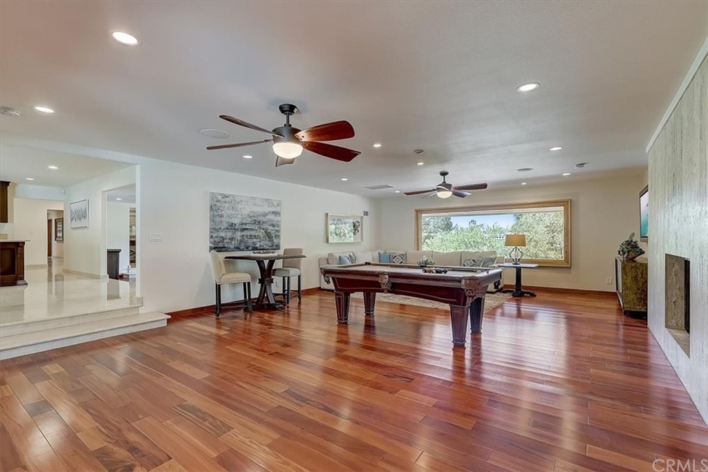 12392 Ranchview Drive Santa Ana, CA 92705 - Photo 22 of 72 a view of a work space with furniture and wooden floor