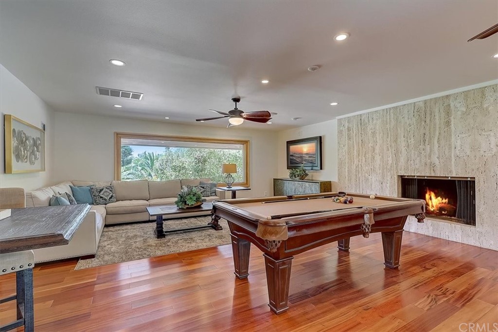 12392 Ranchview Drive Santa Ana, CA 92705 - Photo 23 of 72 a living room with furniture a table and a fireplace