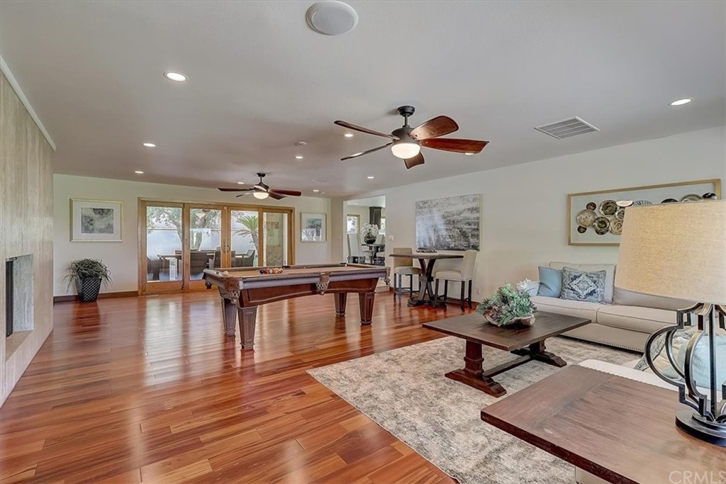 12392 Ranchview Drive Santa Ana, CA 92705 - Photo 25 of 72 a living room with furniture and wooden floor
